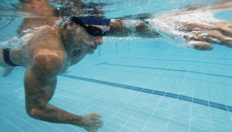 Underwater Shot of a Young Man Swimming in a Pool