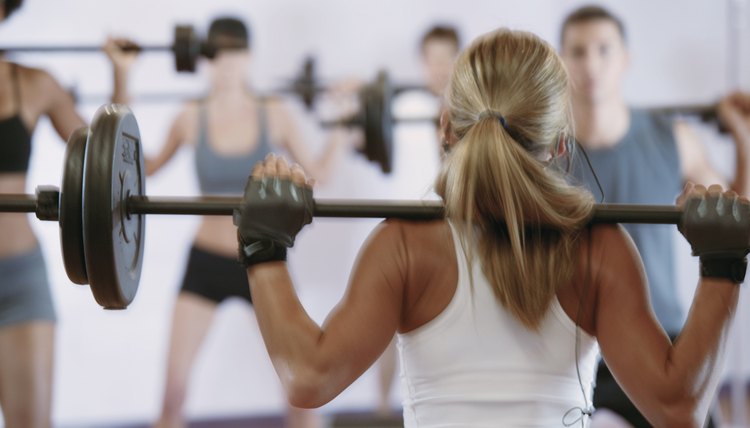 Woman weightlifting in exercise class