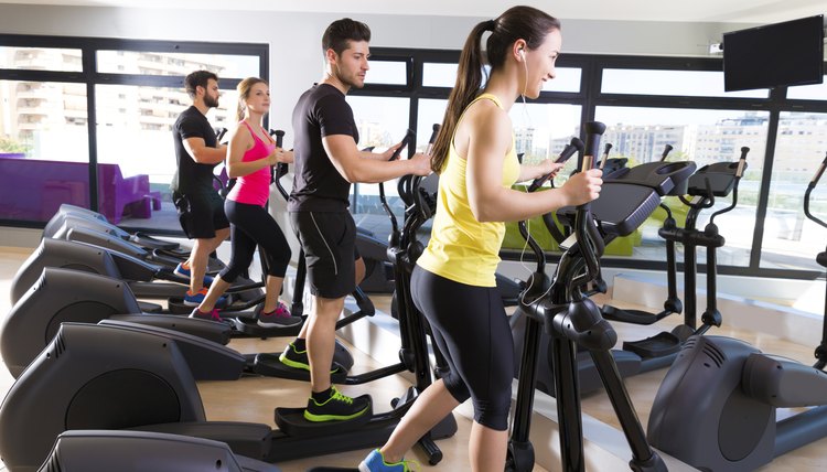 Aerobics elliptical walker trainer group at gym