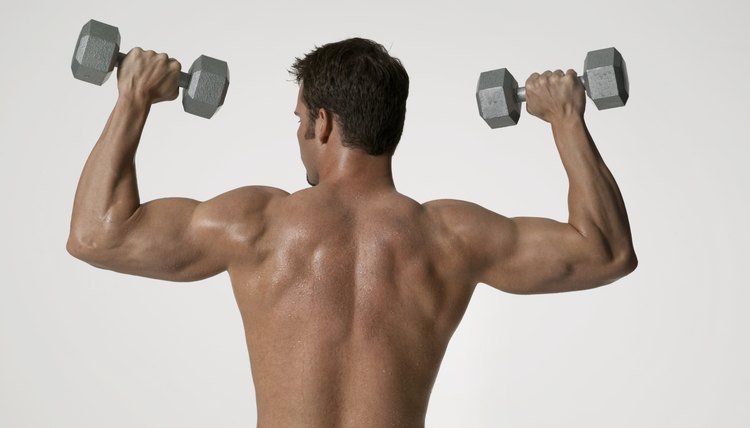 Man lifting up weights rear view