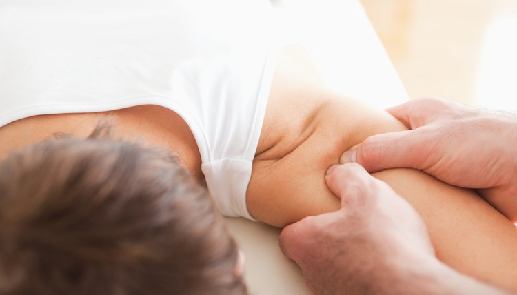 Man massaging a woman's shoulder