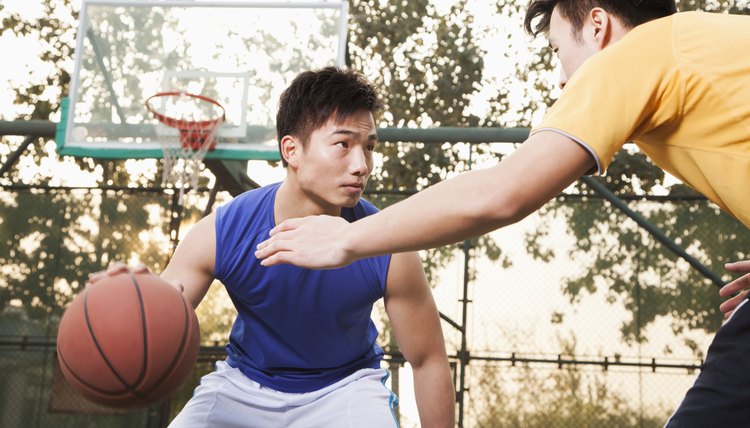 Two street basketball players on the basketball court