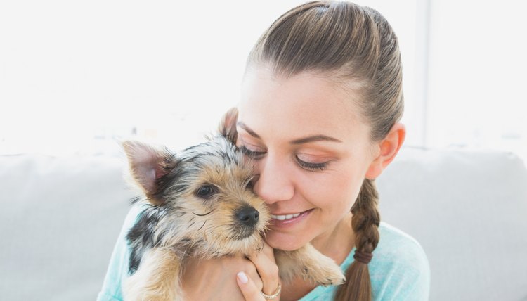 Young woman hugging dog