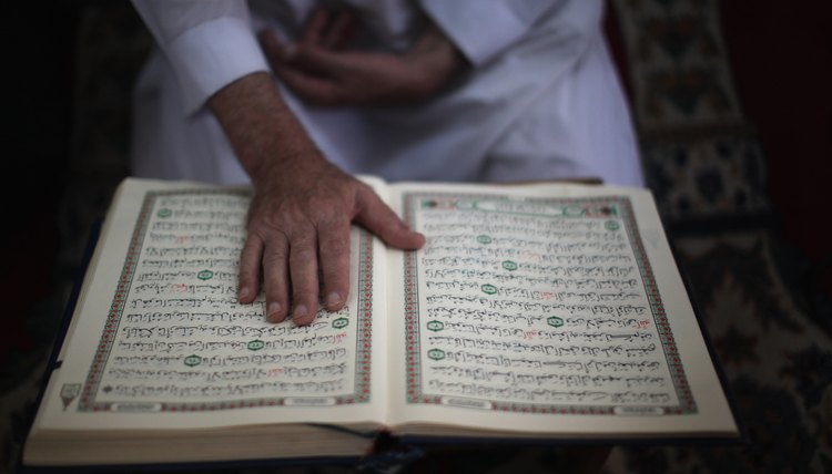 Mourners read from the Quran during traditional Muslim funerals.