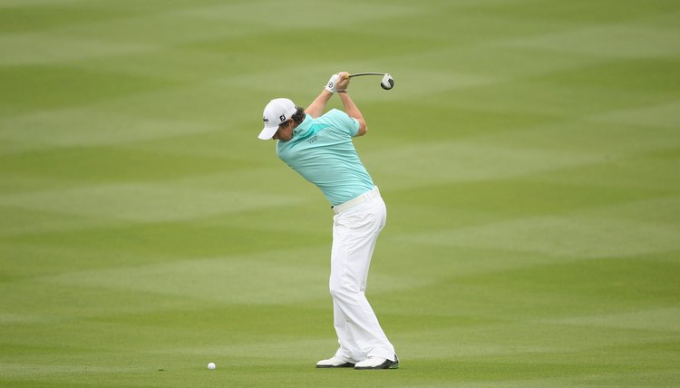 With his right elbow bent and slightly away from his side, McIlroy's wrists finish setting at the top of his backswing.