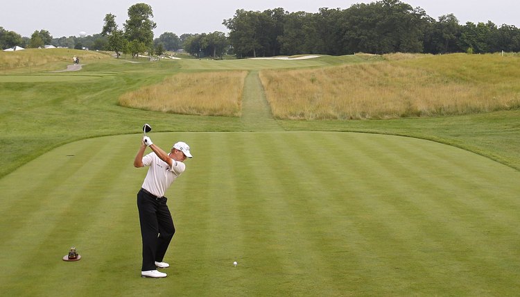 Sometimes using a natural tee can take spin off your drives and hit it straight.