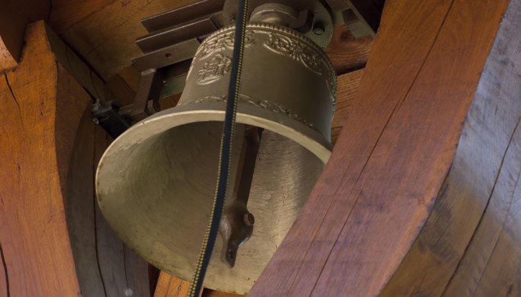 A close up of a Christian church bell.
