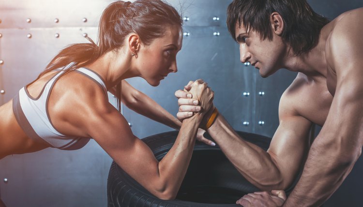 Athlete muscular sportsmen man and woman with hands clasped arm