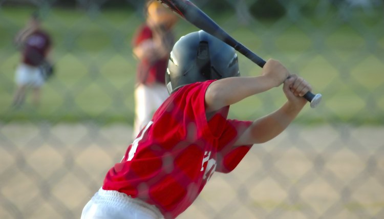 Boy up to bat in baseball game
