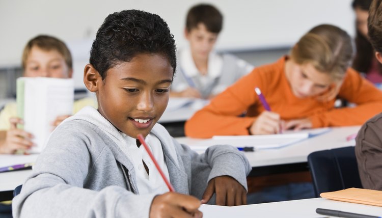 Student taking notes in class