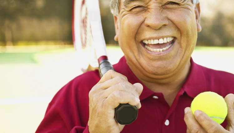 Man with a tennis ball and a racquet