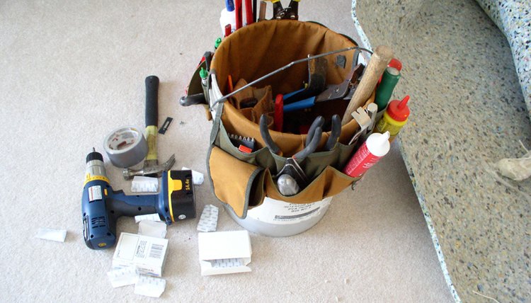 A repurposed 5-gallon bucket becomes a tool carrier.