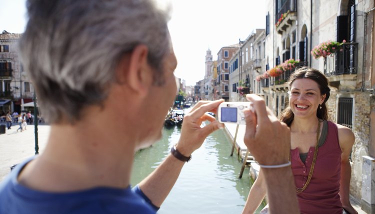 Tourists taking a photo in Italy.