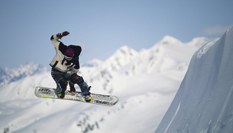 Snowboarder in air, Chugach Mountains, Alaska, USA