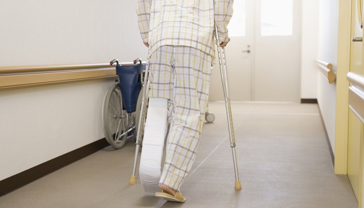 Patient walking with crutches in hospital