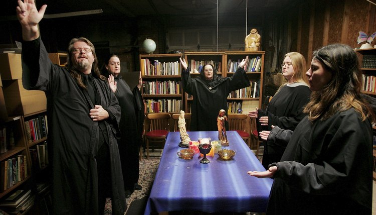 Wiccan altars include candles, incense, figurines and other tools used in rituals.