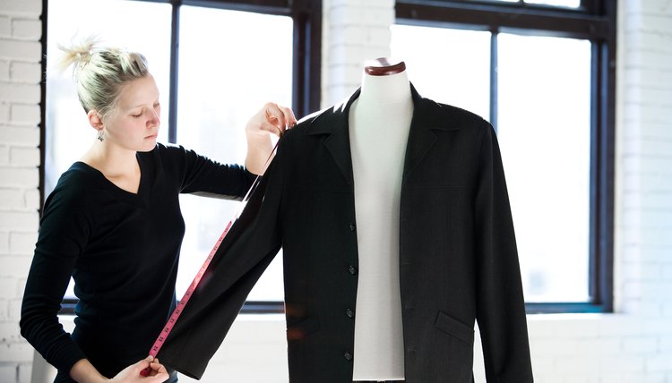 Seamstress measuring sleeve of jacket