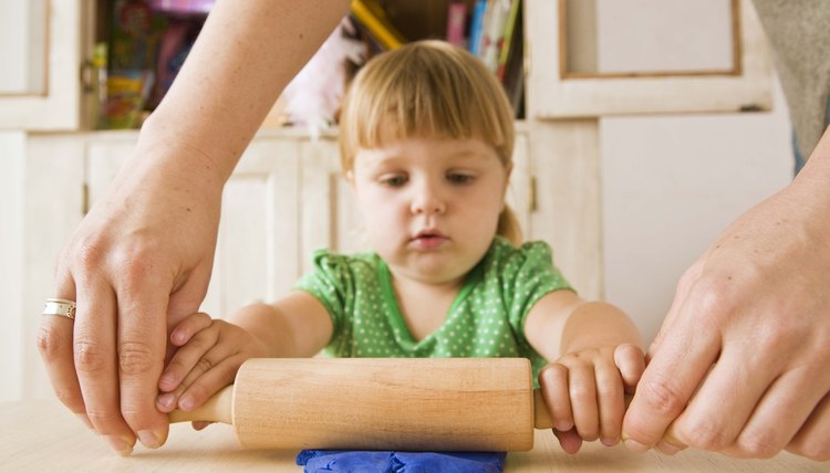 Making play dough teaches children how to follow a simple recipe.