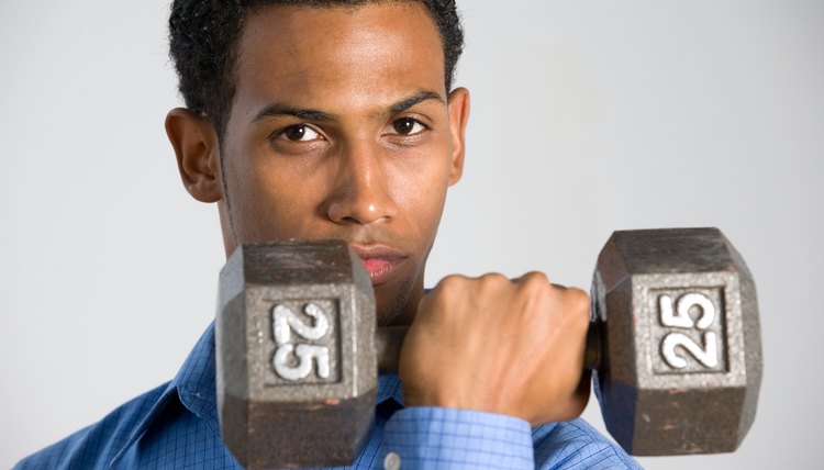 Man posing with dumbbell