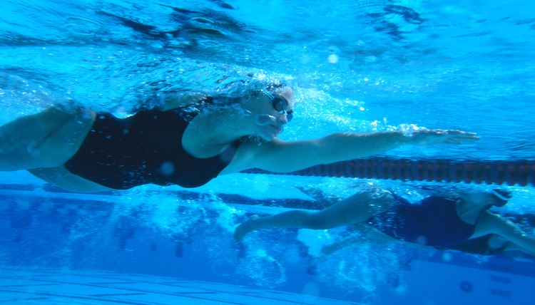 underwater shot of a young female swimmer swimming the freestyle stroke