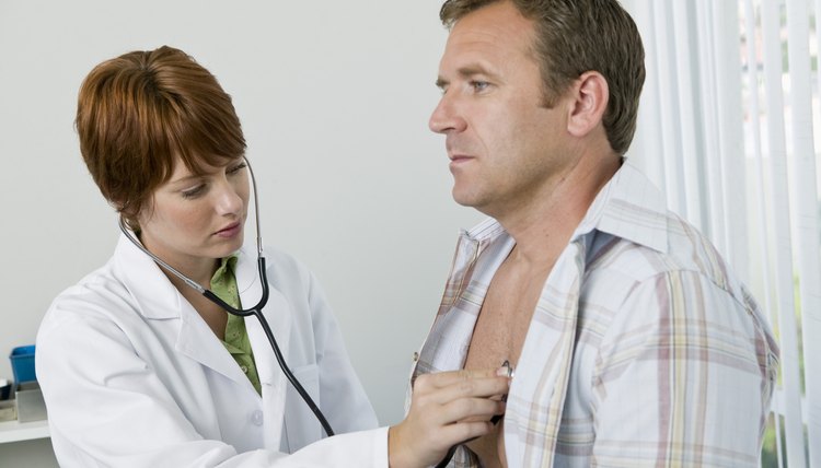 Doctor examining patient with stethoscope