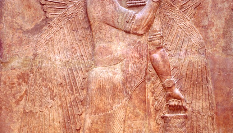 A mesopotamian relief sculpture of a winged sage which represents the tree of life.