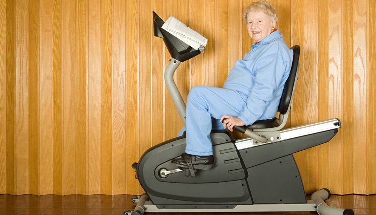 Senior woman on an exercise bike