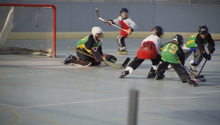 Boys playing rollerhockey