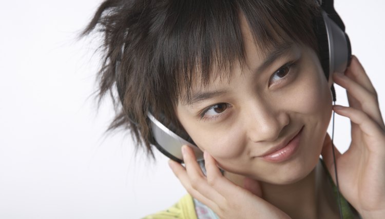 A Chinese teenager listens to music