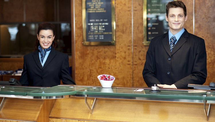 Qualities Of An Exceptional Customer Service Hospitality Employee Front Desk Colleagues Posing For A Picture