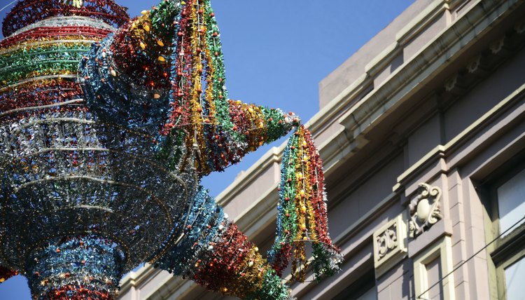 A brightly colored pinata is a focal point of a children's La Posada celebration.