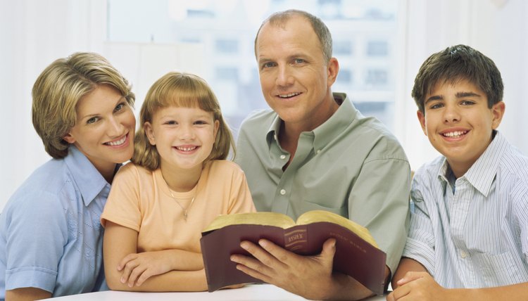 Kids are with their parents learning about the Bible.