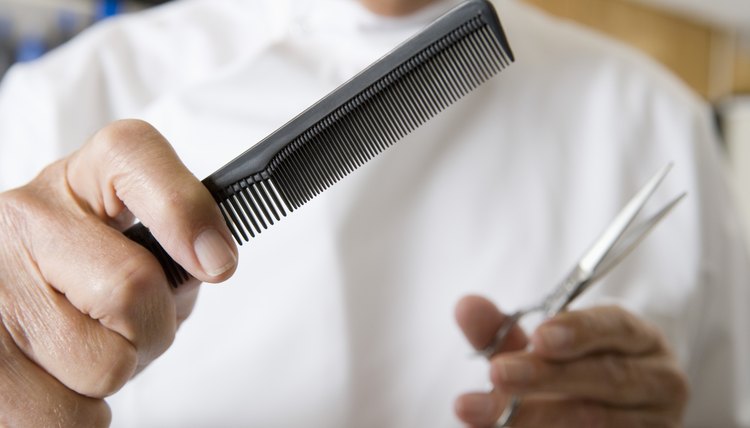 Barber with scissors and comb