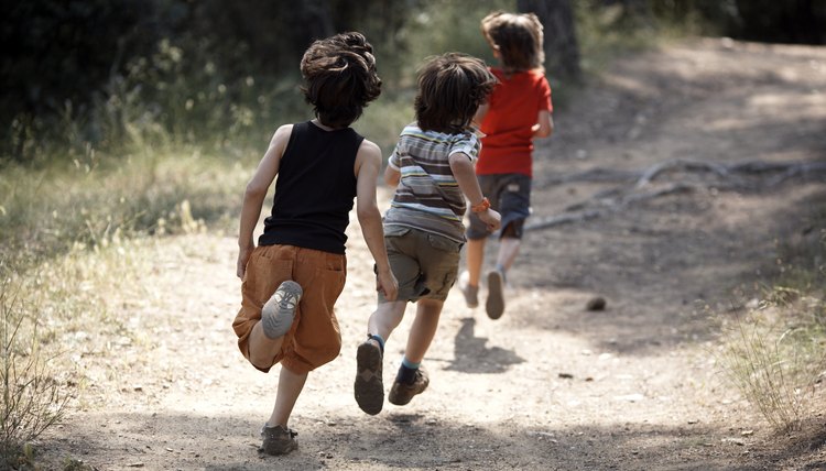 boys running on trail