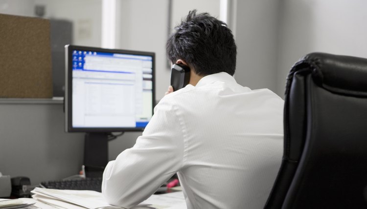 man in office on the telephone