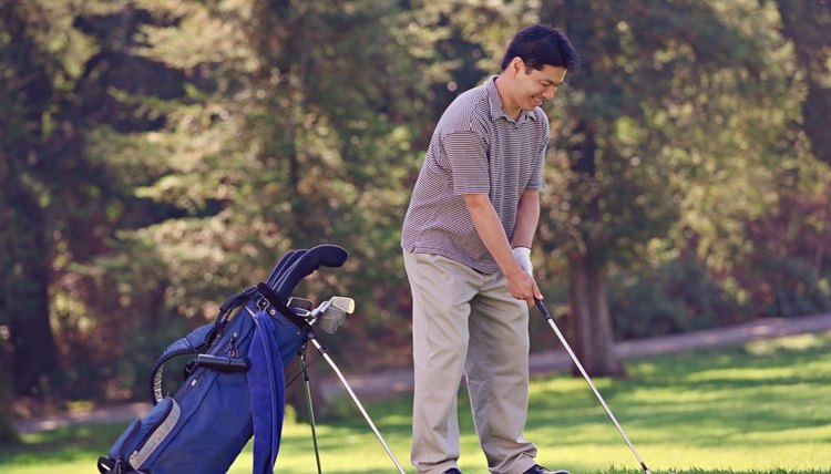 Asian man playing golf