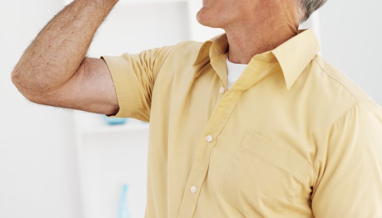 Side view of mature man taking pill