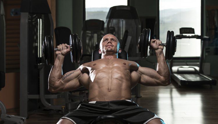 Man Doing Dumbbell Incline Bench Press Workout