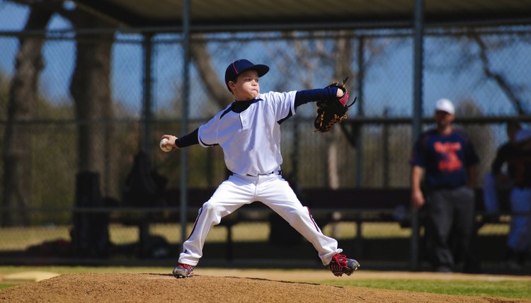 Youth baseball pitcher in wind up