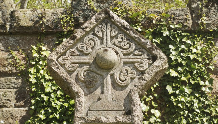 A Rosicrucian cross stone carving in a cemetery in Roslin, Scotland.