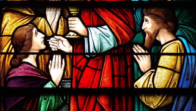 Stained glass of apostles around Jesus.