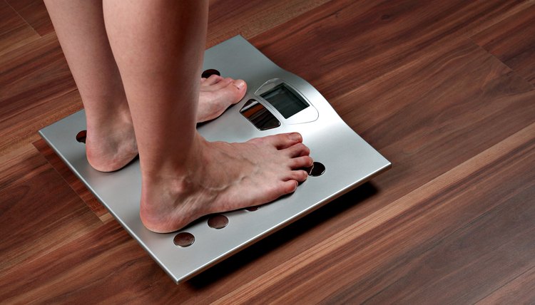 Woman's feet on weight scale