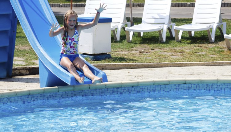 Girl in summer outdoor pool.