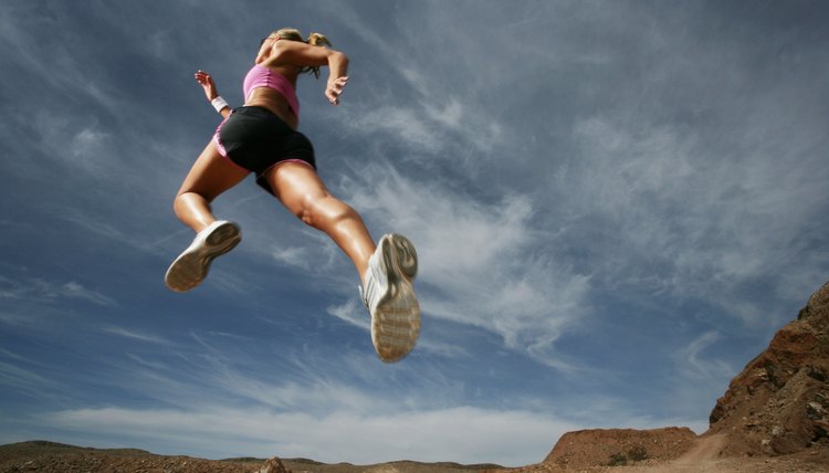Caucasian woman leaping outdoors