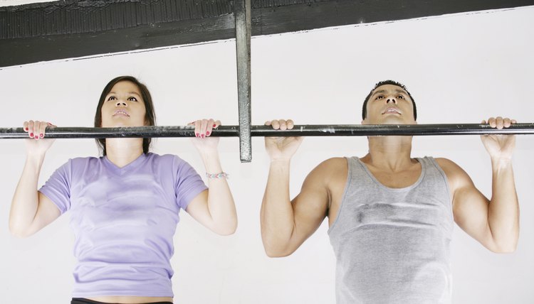 fitness woman and man preparing to do pull ups