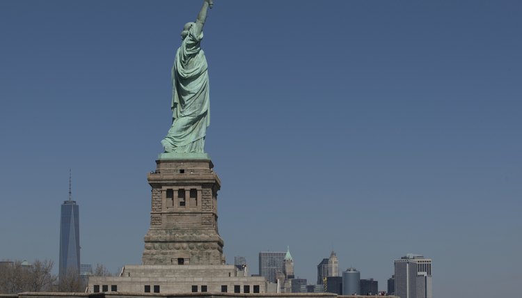 The Statue of Liberty is a symbolic welcome but the USCIS controls access to the country.