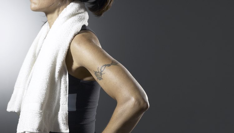 Cropped shot of an athlete with a sports towel around her shoulders