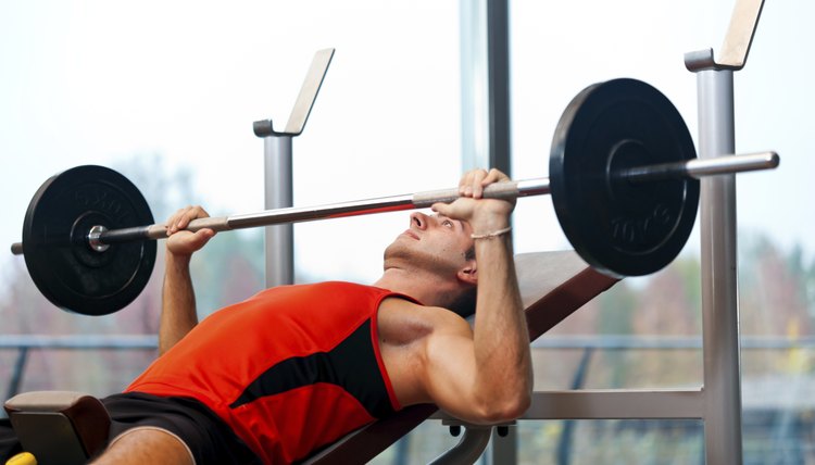 Young athlete lifting weights