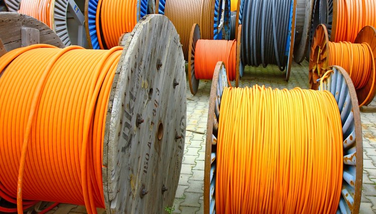 wires of electrical cable on wooden spool