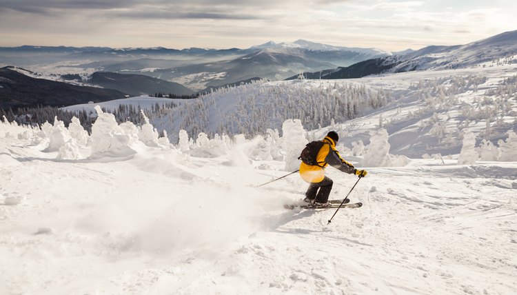 Man Snow Skiing Against Blue Sky